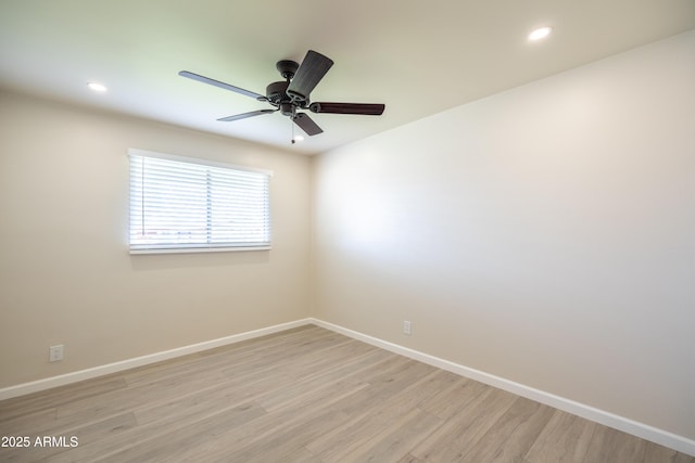 spare room featuring recessed lighting, baseboards, light wood-style floors, and ceiling fan