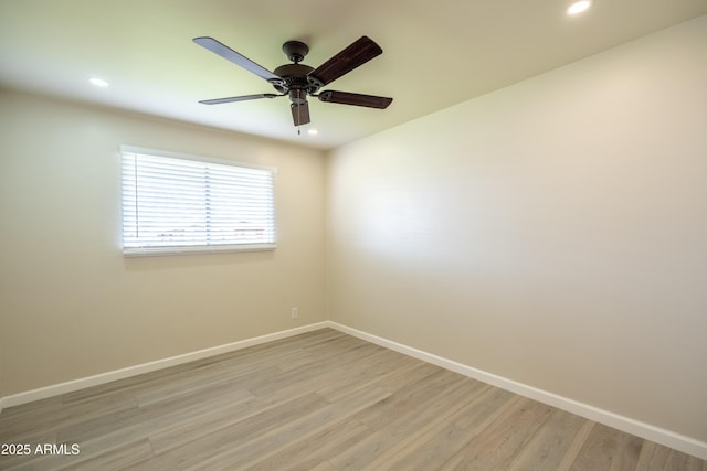 spare room featuring recessed lighting, baseboards, light wood-style flooring, and ceiling fan