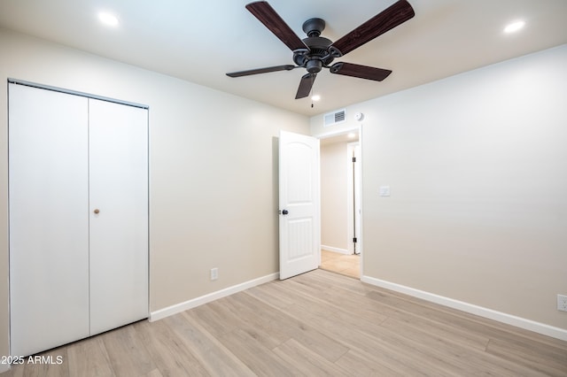 unfurnished bedroom with visible vents, recessed lighting, a closet, light wood finished floors, and baseboards