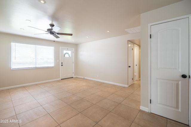 entryway with recessed lighting, light tile patterned floors, a ceiling fan, and baseboards