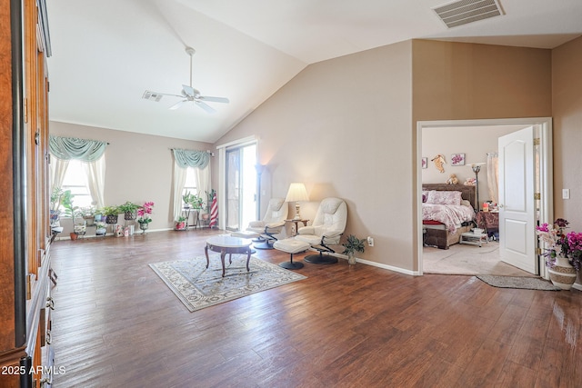 interior space with hardwood / wood-style flooring, ceiling fan, and lofted ceiling