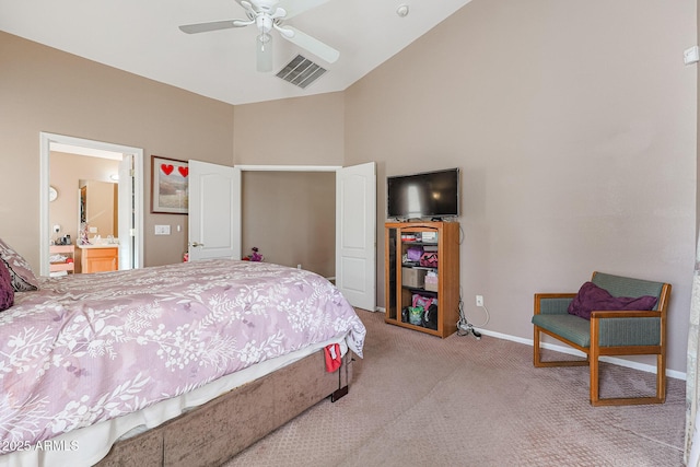 bedroom featuring connected bathroom, light colored carpet, and ceiling fan