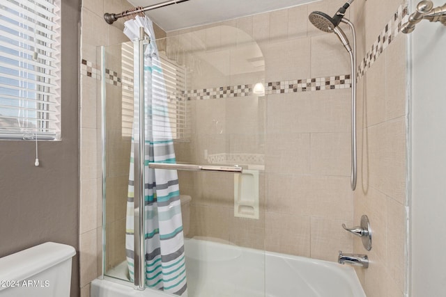 bathroom with toilet and shower / bathtub combination with curtain