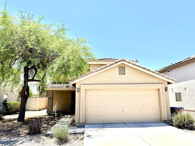 1649 W Wilson Ave, Coolidge, AZ 85128 - view of front of property featuring a tiled roof, stucco siding, concrete driveway, and an attached garage