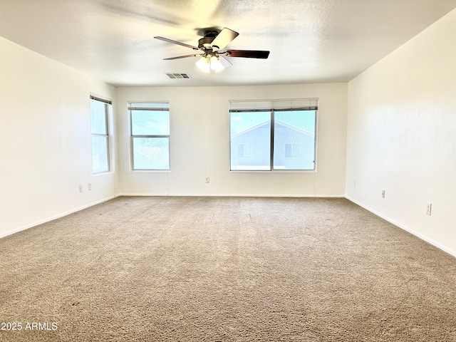 1649 W Wilson Ave, Coolidge, AZ 85128 - carpeted spare room with ceiling fan and baseboards