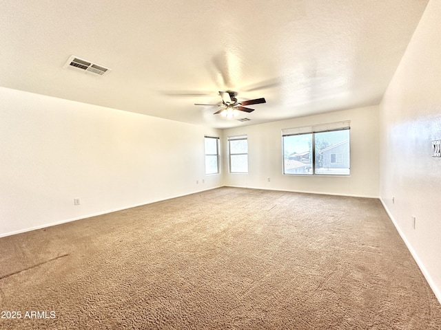 1649 W Wilson Ave, Coolidge, AZ 85128 - spare room featuring carpet and a ceiling fan
