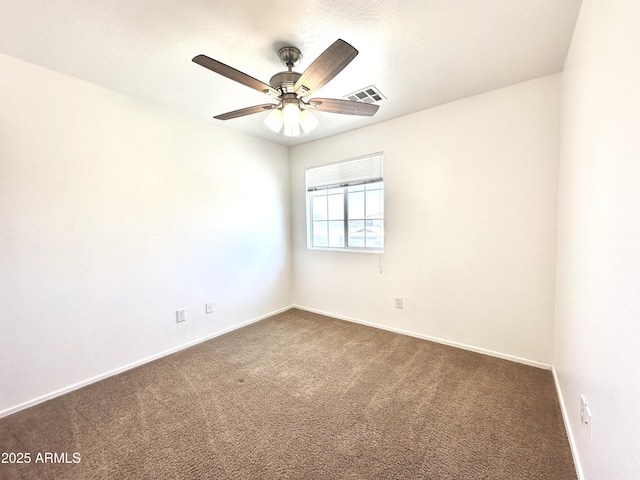 1649 W Wilson Ave, Coolidge, AZ 85128 - empty room featuring dark carpet and ceiling fan