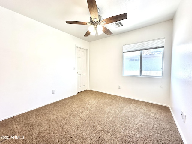 1649 W Wilson Ave, Coolidge, AZ 85128 - empty room featuring carpet and ceiling fan