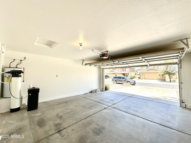 1649 W Wilson Ave, Coolidge, AZ 85128 - garage featuring a garage door opener and baseboards