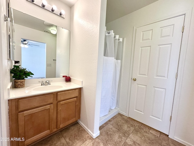 1649 W Wilson Ave, Coolidge, AZ 85128 - bathroom with vanity, a shower with curtain, tile patterned flooring, and a ceiling fan