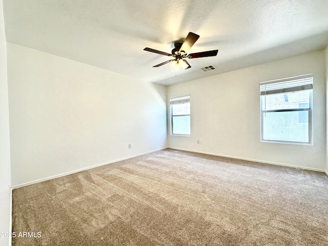 1649 W Wilson Ave, Coolidge, AZ 85128 - empty room with a textured ceiling, carpet floors, and a ceiling fan