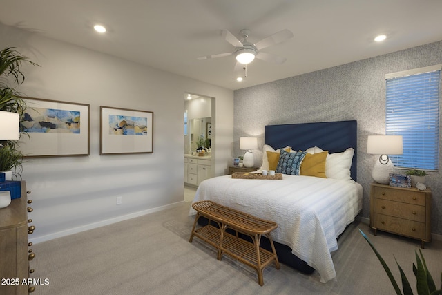 carpeted bedroom featuring connected bathroom and ceiling fan