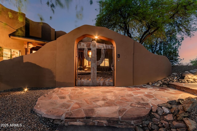 view of outdoor structure at dusk