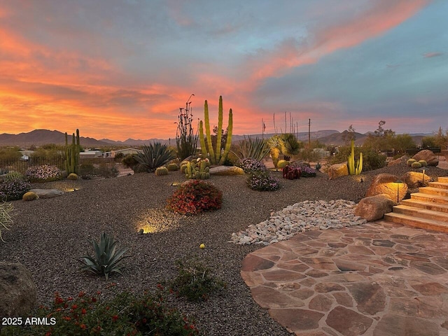 yard at dusk with a mountain view