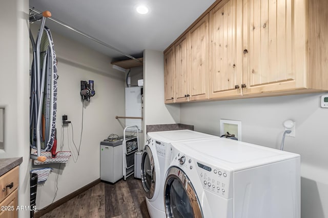 washroom featuring washing machine and clothes dryer, cabinet space, dark wood-type flooring, baseboards, and recessed lighting