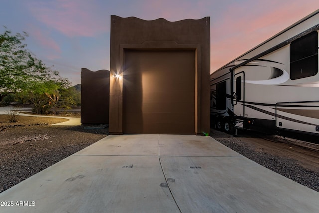 garage with concrete driveway