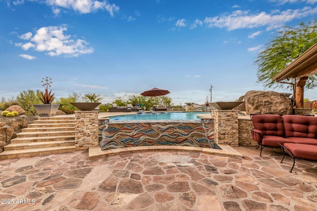 outdoor pool featuring a patio