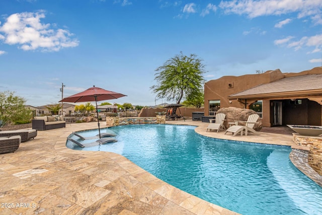 swimming pool featuring an outdoor hangout area, a patio, and fence