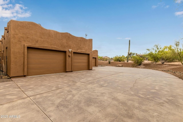 garage featuring driveway