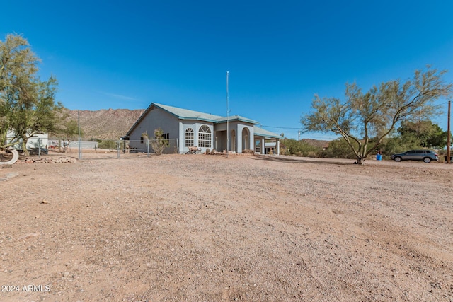 back of property with a mountain view