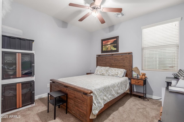 bedroom featuring baseboards, visible vents, carpet floors, and a ceiling fan