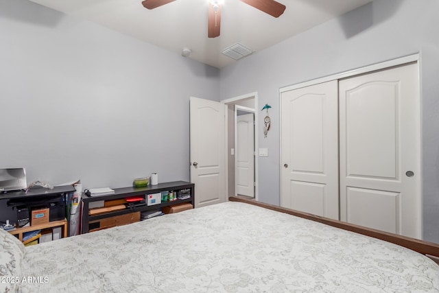 bedroom with a ceiling fan, a closet, and visible vents