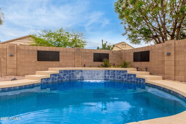 view of swimming pool featuring a fenced in pool and a fenced backyard