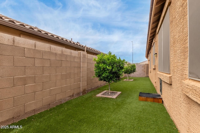view of yard with a fenced backyard