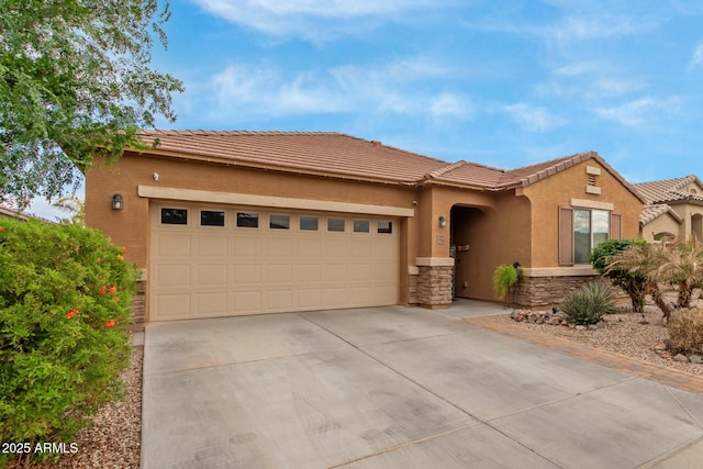 view of front of home featuring stone siding, concrete driveway, stucco siding, an attached garage, and a tiled roof
