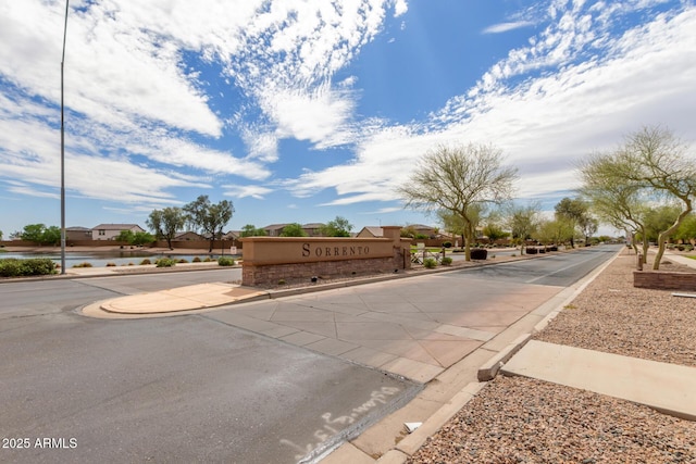 view of street with sidewalks and curbs