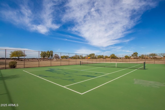 view of tennis court with fence and community basketball court