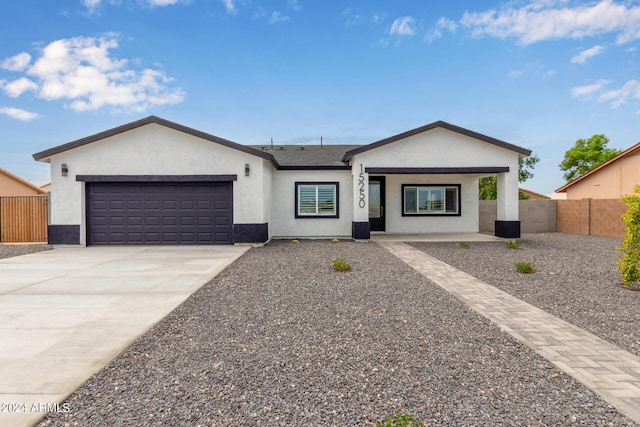 single story home featuring a garage