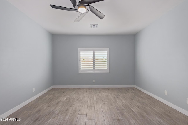 unfurnished room with ceiling fan and light hardwood / wood-style floors