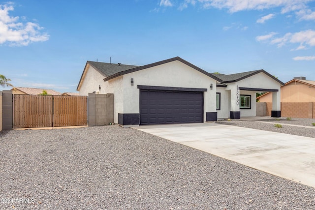 single story home featuring a garage