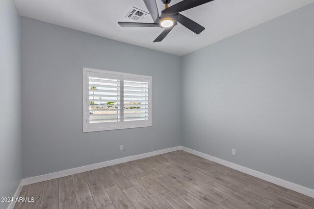 unfurnished room with ceiling fan and light hardwood / wood-style flooring