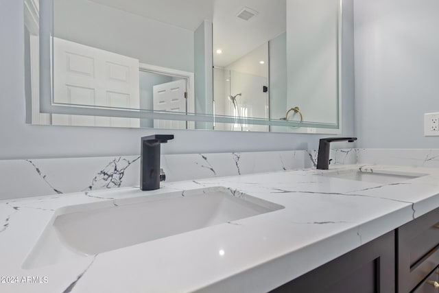 bathroom featuring vanity and walk in shower