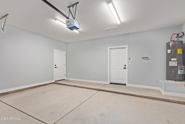 garage with a garage door opener and water heater