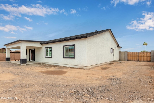 rear view of property with a patio area