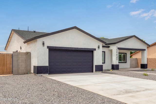 single story home with a garage