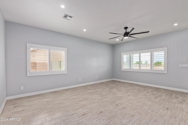 unfurnished room featuring light wood-type flooring and ceiling fan