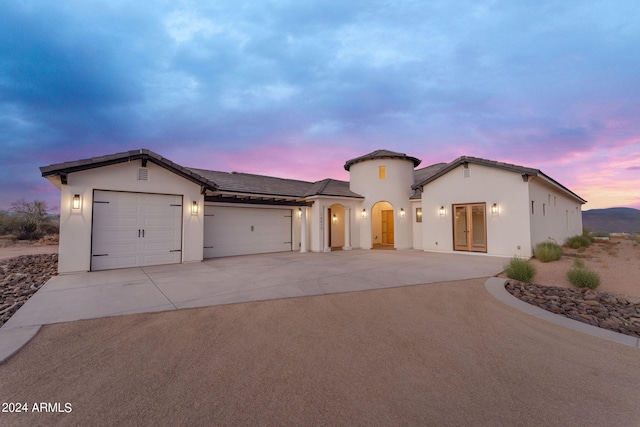 view of front of property with a garage