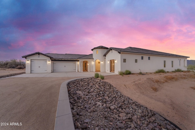 view of front of property featuring a garage