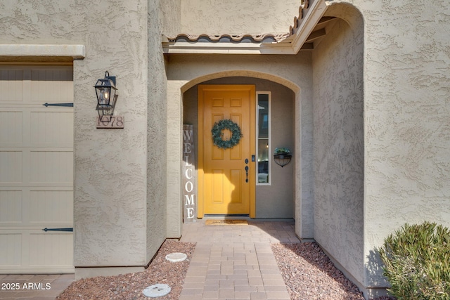 property entrance featuring a garage