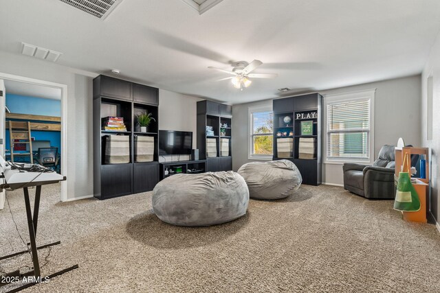 interior space featuring ceiling fan and carpet