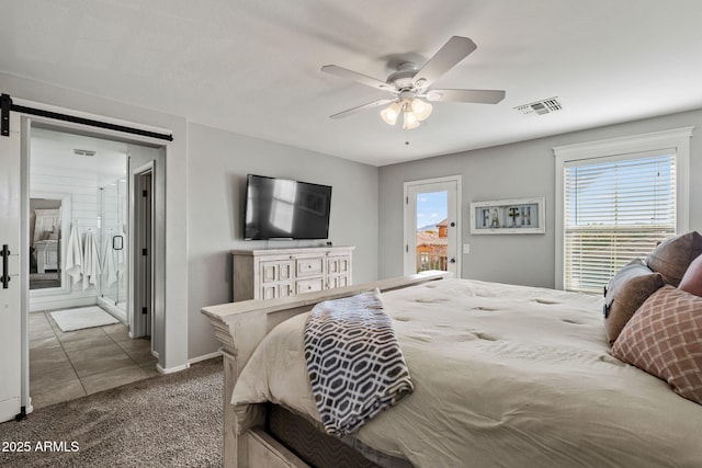 bedroom with ensuite bathroom, carpet, access to exterior, ceiling fan, and a barn door