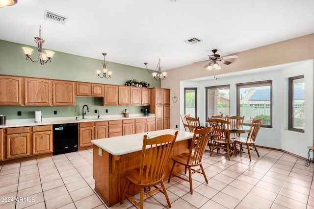 kitchen with ceiling fan with notable chandelier, dishwasher, a center island, sink, and hanging light fixtures