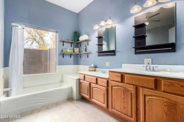 bathroom featuring a tub, vanity, and tile patterned flooring