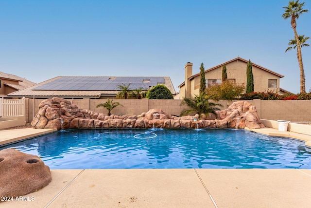 view of swimming pool featuring pool water feature