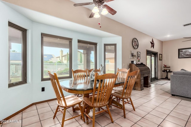 tiled dining room with ceiling fan