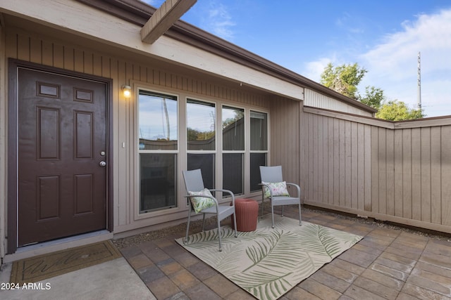 property entrance featuring a patio